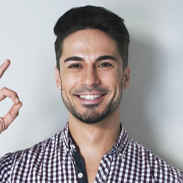 Man smiling, giving 